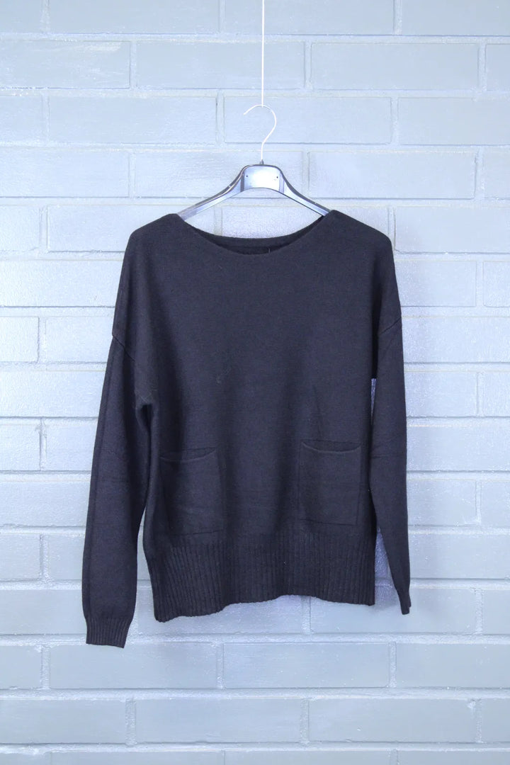 Neule taskuilla Auni