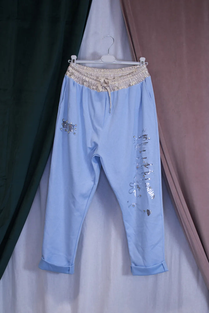 Kimaltavat housut Kia