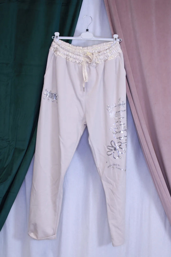 Kimaltavat housut Kia