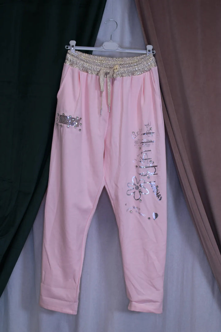 Kimaltavat housut Kia