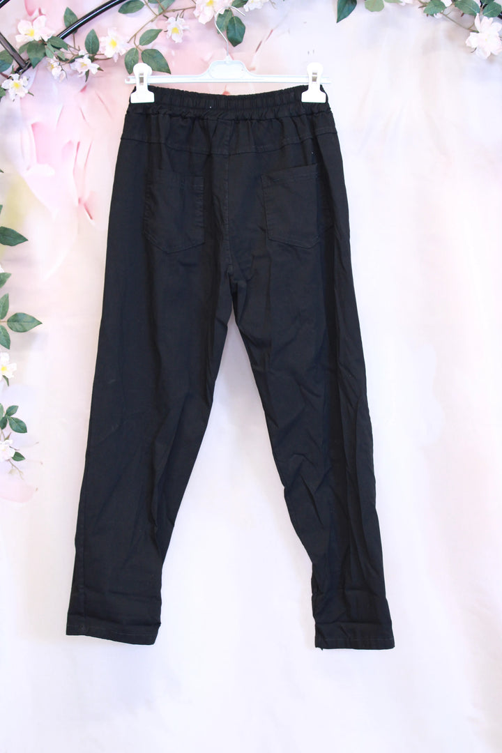 Rennot housut taskuilla - Lauha