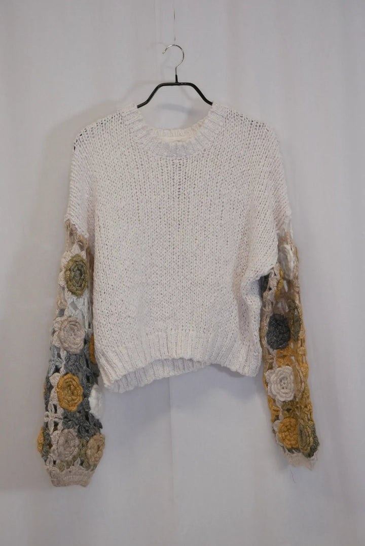 Neule koristehihoilla Saini